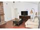 Comfortable living room with hardwood floors and large TV at 3709 Feather Dr, Lakeland, FL 33812