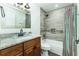 Updated bathroom with modern fixtures, a combination tub/shower, and a neutral color scheme at 4617 S Devon Ave, Lakeland, FL 33813