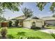 Charming single-story home with a well-manicured lawn and attached garage at 4617 S Devon Ave, Lakeland, FL 33813