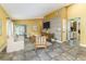 Comfortable living area features neutral furnishings and seamless access to the kitchen and outdoor patio at 4617 S Devon Ave, Lakeland, FL 33813