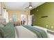 An airy main bedroom with an ensuite bathroom, ample lighting, and a ceiling fan at 4617 S Devon Ave, Lakeland, FL 33813