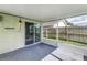 Enclosed patio area featuring sliding glass doors and screening with an exterior view at 4617 S Devon Ave, Lakeland, FL 33813