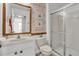 Stylish bathroom with walk-in shower and patterned wall at 531 Las Fuentes Dr, Kissimmee, FL 34746