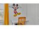 Bedroom area with a Mickey Mouse wall art and a desk at 531 Las Fuentes Dr, Kissimmee, FL 34746