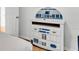 Themed bedroom with decorative dresser and Star Wars R2-D2 design at 531 Las Fuentes Dr, Kissimmee, FL 34746