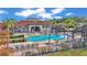 Community pool with lounge chairs and cabanas at 531 Las Fuentes Dr, Kissimmee, FL 34746