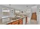 Open-concept kitchen featuring granite countertops and stainless steel appliances with views of the living area at 531 Las Fuentes Dr, Kissimmee, FL 34746