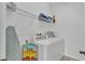 Laundry room with washer, dryer, and shelving at 531 Las Fuentes Dr, Kissimmee, FL 34746