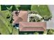 Impressive aerial view of a well-maintained home, showcasing its landscaping and backyard patio at 535 Narrow Pond Rd, Polk City, FL 33868