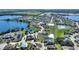Wide aerial view of waterfront homes in a residential neighborhood with multiple lakes and green spaces at 535 Narrow Pond Rd, Polk City, FL 33868