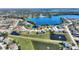 Aerial view of lakeside community, boasting of ponds, well-maintained landscaping and lush greenery at 535 Narrow Pond Rd, Polk City, FL 33868