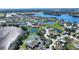 Breathtaking aerial view of a lakeside community showcasing the community pool and recreational facilities at 535 Narrow Pond Rd, Polk City, FL 33868