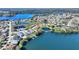 Scenic aerial shot of a lakefront neighborhood featuring homes with private docks and stunning water views at 535 Narrow Pond Rd, Polk City, FL 33868