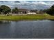Exterior view of the community clubhouse as seen from across the lake at 535 Narrow Pond Rd, Polk City, FL 33868