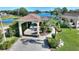 Beautiful home with large covered parking area, lush landscaping and inviting curb appeal at 535 Narrow Pond Rd, Polk City, FL 33868