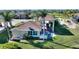 Aerial view of yard with tropical landscaping, covered parking and outdoor seating at 535 Narrow Pond Rd, Polk City, FL 33868