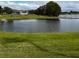 Enjoy serene water views from this lush green outdoor space at 535 Narrow Pond Rd, Polk City, FL 33868