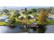 This waterfront property features a private dock and easy access to the tranquil lake and scenic views at 6029 Avocado Dr, Indian Lake Estates, FL 33855