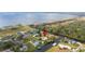 Waterfront home with direct access to the lake via private canal, perfect for boating and enjoying nature at 6029 Avocado Dr, Indian Lake Estates, FL 33855