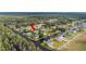 Waterfront property on a canal, surrounded by lush greenery and offering direct access to the expansive lake at 6029 Avocado Dr, Indian Lake Estates, FL 33855