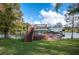 Tranquil backyard with a private dock, ideal for waterfront living and enjoying peaceful views at 6029 Avocado Dr, Indian Lake Estates, FL 33855