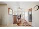 This spacious home features a convenient bar area with tiled floors, seamlessly connecting to the kitchen and foyer at 6029 Avocado Dr, Indian Lake Estates, FL 33855