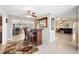 Open-concept bar area with tiled flooring and a view into other living areas offers an ideal spot for entertaining at 6029 Avocado Dr, Indian Lake Estates, FL 33855