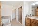 Spacious bathroom featuring separate vanity and shower area, complemented by tile flooring at 6029 Avocado Dr, Indian Lake Estates, FL 33855
