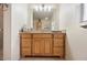Well-lit bathroom with a large vanity, featuring drawers and cabinets for ample storage at 6029 Avocado Dr, Indian Lake Estates, FL 33855