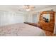 Bedroom showcasing a ceiling fan, hardwood floors, dresser, and a closet at 6029 Avocado Dr, Indian Lake Estates, FL 33855
