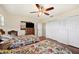 Bright bedroom featuring hardwood floors, and ample closet space, perfect for storage and organization at 6029 Avocado Dr, Indian Lake Estates, FL 33855