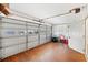 Spacious garage with painted walls, a row of windows, and a durable wood-look floor at 6029 Avocado Dr, Indian Lake Estates, FL 33855