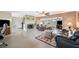 This living room features a fireplace, neutral paint, tiled floors, and multiple seating options perfect for gatherings at 6029 Avocado Dr, Indian Lake Estates, FL 33855