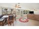 Inviting sunroom with many windows offering natural light, a ceiling fan, and comfortable seating at 6029 Avocado Dr, Indian Lake Estates, FL 33855