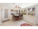 Cozy sunroom featuring tiled floors, large windows with views, and an inviting seating area at 6029 Avocado Dr, Indian Lake Estates, FL 33855