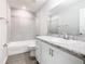 Clean bathroom with a shower-tub combination and a vanity with a granite countertop at 1354 Mezzavalle Way, Auburndale, FL 33823