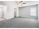 Bright, spacious bedroom with plush carpeting, an ensuite bathroom, and a walk-in closet at 1354 Mezzavalle Way, Auburndale, FL 33823