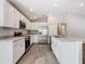 Modern kitchen featuring stainless steel appliances, granite countertops, and ample cabinet space at 1354 Mezzavalle Way, Auburndale, FL 33823
