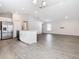 Modern kitchen with stainless steel appliances, an island, and ample cabinet space at 1354 Mezzavalle Way, Auburndale, FL 33823
