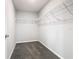 Organized walk-in closet with shelving for easy storage at 1354 Mezzavalle Way, Auburndale, FL 33823