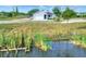 Single-story house with attached garage near a canal at 2116 Sarah Way, Mulberry, FL 33860