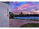 Home's backyard patio overlooks a peaceful lake at 2116 Sarah Way, Mulberry, FL 33860