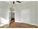 Bedroom with private bathroom access and wood floors at 2116 Sarah Way, Mulberry, FL 33860