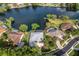 Aerial view of waterfront home in a quiet community at 5933 Lake Victoria Dr, Lakeland, FL 33813