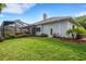Landscaped backyard with screened enclosure and pool at 5933 Lake Victoria Dr, Lakeland, FL 33813