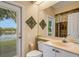 Bathroom with lake view and walk-in shower at 5933 Lake Victoria Dr, Lakeland, FL 33813