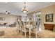 Elegant dining room with chandelier and seating for eight at 5933 Lake Victoria Dr, Lakeland, FL 33813