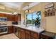 Kitchen features a window overlooking a lake at 5933 Lake Victoria Dr, Lakeland, FL 33813