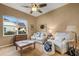 Relaxing living room with comfortable seating and a large window at 5933 Lake Victoria Dr, Lakeland, FL 33813
