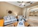 Cozy living room featuring comfortable seating and a view into dining area at 5933 Lake Victoria Dr, Lakeland, FL 33813